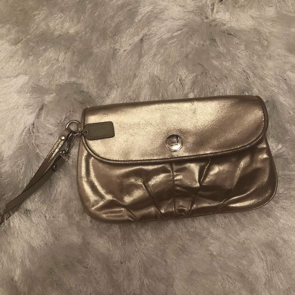 Coach champagne gold wristlet